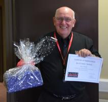 Roy Clough receiving his 15 year award for Volunteering at Haynes International Motor Museum